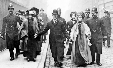 Emmeline Pankhurst being escorted by police officers in 1910