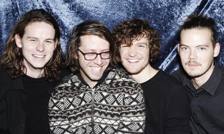 Canadian band Half Moon Run sitting together