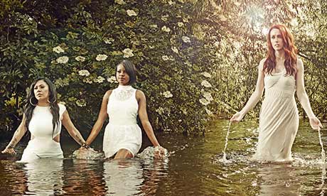Sugababes wading through waist-deep water