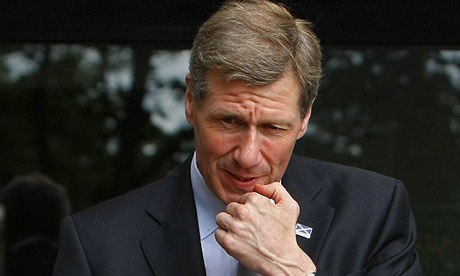 Scotland's Justice Secretary Kenny MacAskill gestures during a visit to a police station in Glasgow