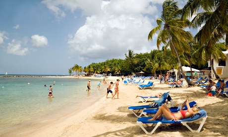 people sunbathing on a beach holiday