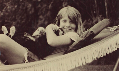 ‘Bell jar of private despair’: Kim as a child, with her cat, Gretel.