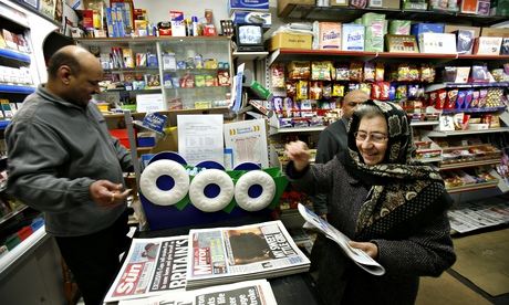 Customer buying newspaper