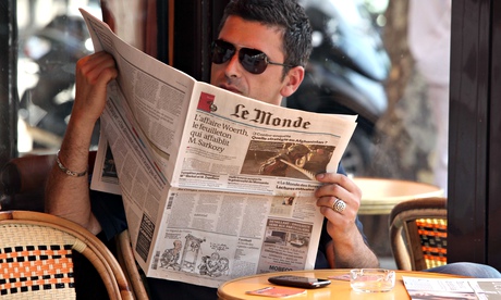  Man reading Le Monde