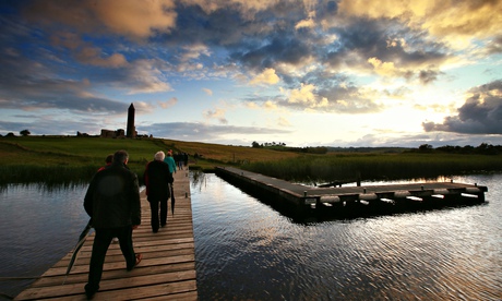‘Diffusion of self into place’: the audience cross at twilight to Devenish island for Ohio Imprompt