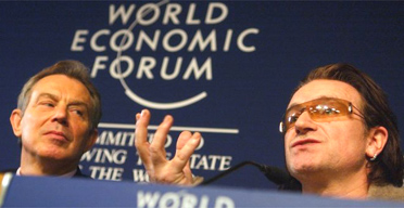 Tony Blair shares a stage with Bono of U2 at the World Economic Forum in Davos, Switzerland