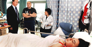 The Conservative Party leader, David Cameron, talks to Carl and Maria Boucher, the parents of Hannah, 16, from Hengoed, south Wales, in the Sky Ward of Great Ormond Street hospital, central London, on Monday October 9 2006. Photograph: John Stillwell/PA.