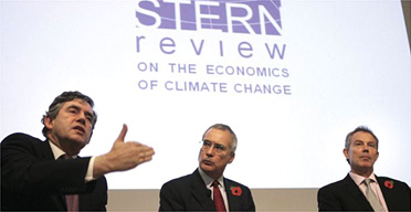 Sir Nicholas Stern is accompanied by Gordon Brown and Tony Blair during a presentation of his report on climate change at the Royal Society 