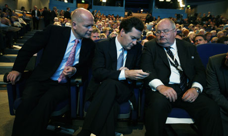 Tory frontbenchers William Hague, George Osborne and Eric Pickles check Osborne's BlackBerry before David Cameron's speech to the Conservative conference in Birmingham on September 30 2008. Photograph: Martin Argles