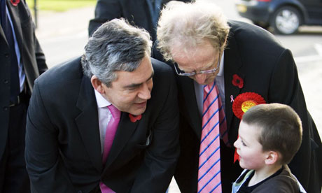 Gordon Brown with Labour candidate Lindsay Roy talking to a small boy as they campaign in the Glenrothes byelection on October 31 2008. Photograph: Murdo Macleod