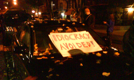 A sign saying 'Idiocracy avoided' on a car at a street party in New York's East Village following Barack Obama's presidential victory on November 4 2008. Photograph: Paul Owen