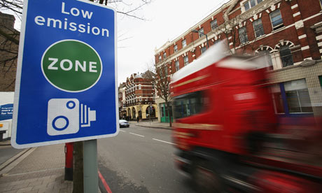 A lorry passes a low emission zone sign in London. Photograph: Daniel Berehulak/Getty Images
