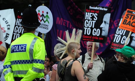 Demonstrators take part in a march through Manchester