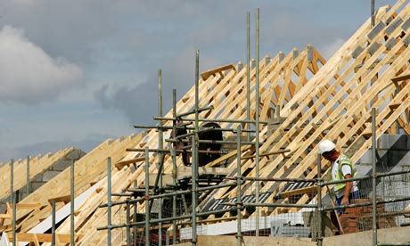 A construction worker building a roof