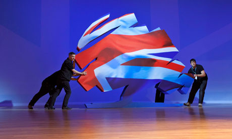 A piece of stage furniture is moved at the Conservative party conference