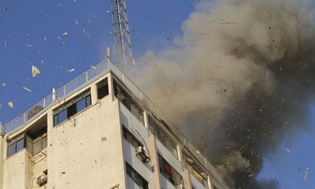 Smoke rises after an Israeli air strike on an office of Hamas television channel al-Aqsa