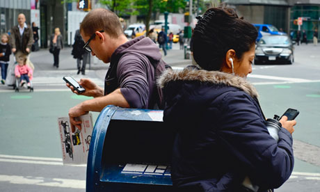 Two people using iPhones