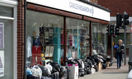 Donated clothes outside charity shop 