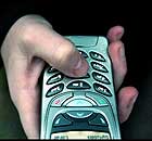 A teenager using a mobile phone to send a text.  