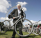 Wheels within wheels: Proud cyclist Boris Johnson in front of the London Eye