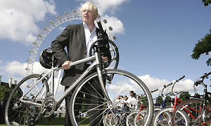 Wheels within wheels: Proud cyclist Boris Johnson in front of the London Eye