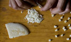 A drug dealer divides up crack