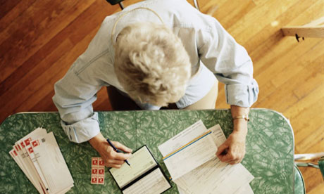 An older woman sorts out her finances