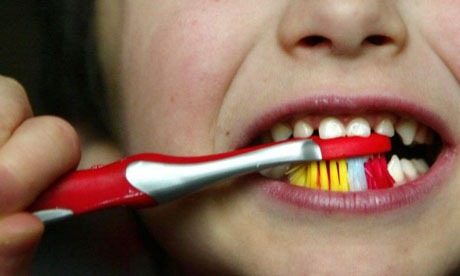 Child brushing teeth