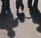 Family and child in shadows