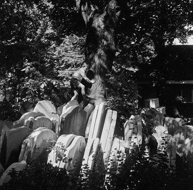 Gallery John Gay retrospective: Boy playing on gravestones