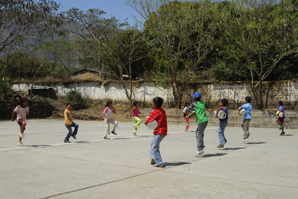 The Young Lives project: Children playing drums and dancing in Peru
