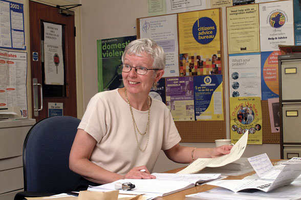 Citizens Advice at 70: A specialist Citizens Advice case worker checking through client documents