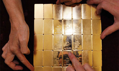 Austian workers hold gold during stamping