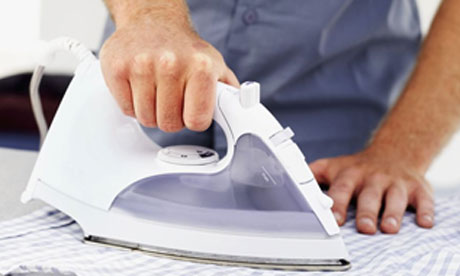 Man ironing shirt