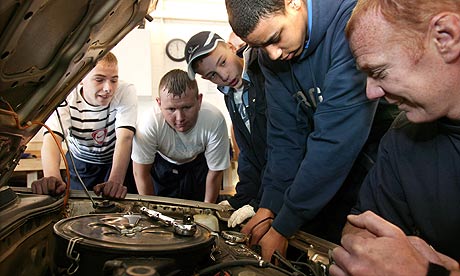 Brian Critchley (right) course tutor at Bolton WISE with students on the vehicle maintenance course.