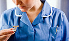 Nurse checking the time