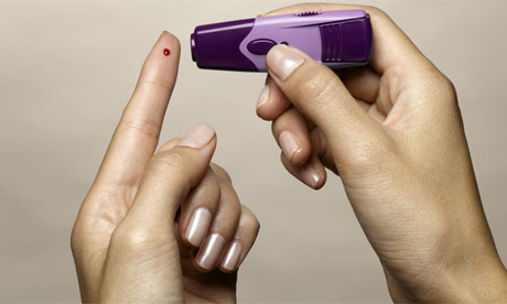 Woman using diabetes test kit
