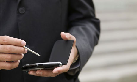 Businessman using PDA