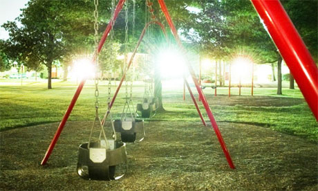 Swings on playground, night