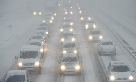 Cars drive in snow near Rotterdam on December 17, 2010