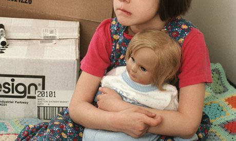 girl holding doll