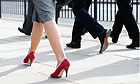 Commuters walking over London bridge 