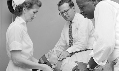 A patient at a mental hospital in about 1955 undergoes electroconvulsive therapy (ECT)
