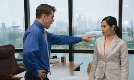 Businessman yelling at coworker