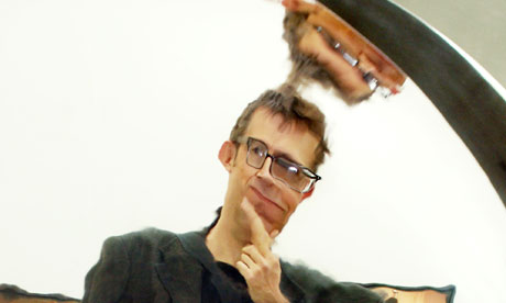 Man looks in distorted mirror