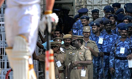 Armed guards look on during day three of the first Test between India and England in Chennai