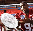 University of Oklahoma defender Alan Davis poses with the BCS Championship trophy