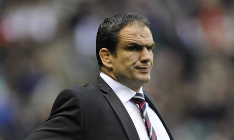 England's coach Martin Johnson looks on before his team take on New Zealand