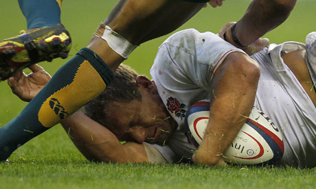 Jonny Wilkinson falls to the ground after being tackled