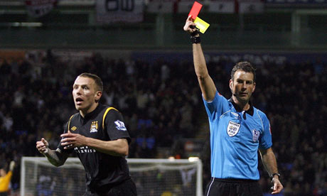 Referee Mark Clattenburg sends off Manchester City's Craig Bellamy for 